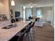 Spacious living room featuring a modern kitchen with island and cozy seating area at 46 Atherton Circle, Angier, NC 27501