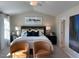 Inviting main bedroom with two chairs, a plush bed, and large windows at 46 Atherton Circle, Angier, NC 27501