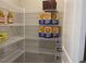 Organized pantry with wire shelving stocked with cereal boxes and juice at 46 Atherton Circle, Angier, NC 27501