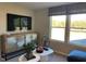 Sitting area with large windows, view of the outdoors, and stylish furnishings at 46 Atherton Circle, Angier, NC 27501
