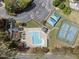 An aerial view featuring the pool, clubhouse, tennis courts, parking, and landscaping at 4724 Worchester Pl, Raleigh, NC 27604