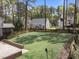 Lush backyard features a manicured artificial lawn, fence, and patio area, perfect for outdoor enjoyment and entertaining at 4724 Worchester Pl, Raleigh, NC 27604
