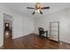 Spacious bedroom featuring wood floors, ceiling fan, and closet for ample storage at 4724 Worchester Pl, Raleigh, NC 27604