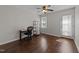 Versatile bedroom with hardwood floors, a ceiling fan, a window, and a door to the outside at 4724 Worchester Pl, Raleigh, NC 27604