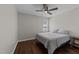 Cozy bedroom showcasing wood floors, neutral walls, and a ceiling fan at 4724 Worchester Pl, Raleigh, NC 27604