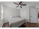 Comfortable bedroom featuring a ceiling fan, closet and natural light at 4724 Worchester Pl, Raleigh, NC 27604