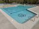 Large swimming pool with clearly marked lanes, shallow end, and lion logo on pool floor at 4724 Worchester Pl, Raleigh, NC 27604