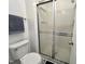 Clean bathroom featuring a walk-in shower with a glass enclosure at 4907 Hollenden Dr # 105, Raleigh, NC 27616