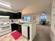Modern kitchen featuring a breakfast bar that flows into the open concept living area at 4907 Hollenden Dr # 105, Raleigh, NC 27616