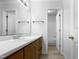 Bathroom featuring a long vanity with an extended mirror with views of the tub and shower at 5620 Hamstead Xing, Raleigh, NC 27612