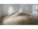 Spacious bedroom with neutral carpet, a large window with natural light, and a walk-in closet at 5620 Hamstead Xing, Raleigh, NC 27612