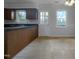 Cozy kitchen area with plenty of sunlight coming from windows and door leading to deck at 5620 Hamstead Xing, Raleigh, NC 27612