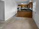 Cozy kitchen with wooden cabinets, a breakfast bar, and stainless steel appliances at 5620 Hamstead Xing, Raleigh, NC 27612