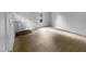 Empty living room ready for staging with carpet and a front door, plus windows at 5620 Hamstead Xing, Raleigh, NC 27612