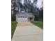 Attractive single-story home with a long drive and an attached two car garage at 5710 Russell Rd, Durham, NC 27712