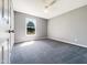 Simple bedroom with a window view providing natural light, and soft carpeting at 5908 O C Hester Rd, Holly Springs, NC 27540