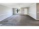 Spacious living room with a large window, neutral walls, and plush carpeting at 5908 O C Hester Rd, Holly Springs, NC 27540