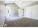 Primary bedroom with en-suite bath, carpeted floors, and dual closets for plenty of storage at 5908 O C Hester Rd, Holly Springs, NC 27540