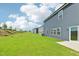 Spacious backyard featuring lush green grass, providing an ideal space for outdoor activities and relaxation at 601 White Birch Ln, Angier, NC 27501