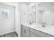 Bathroom featuring double vanity with gray cabinets and a large mirror at 601 White Birch Ln, Angier, NC 27501