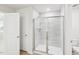 Bathroom featuring an enclosed shower with tiled walls and glass door at 601 White Birch Ln, Angier, NC 27501