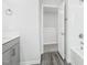 Bathroom showcasing gray wood-look floors, gray cabinets and a shower/tub at 601 White Birch Ln, Angier, NC 27501