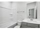 Clean bathroom with a tub, toilet, and gray vanity with a mirror at 601 White Birch Ln, Angier, NC 27501