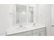 Bathroom features double sinks, white cabinets, and a shower-tub combo at 601 White Birch Ln, Angier, NC 27501