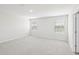 Bright bedroom with neutral carpet, white walls and two windows at 601 White Birch Ln, Angier, NC 27501