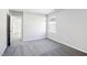 Spacious bedroom with neutral walls, carpet, and a window for natural light at 601 White Birch Ln, Angier, NC 27501