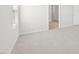 Bedroom with neutral carpet, white walls, and access to other rooms at 601 White Birch Ln, Angier, NC 27501