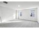 Large bedroom featuring soft carpet and bright windows at 601 White Birch Ln, Angier, NC 27501