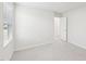 Airy bedroom with neutral carpet, a window, and an open doorway at 601 White Birch Ln, Angier, NC 27501