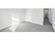 Bright bedroom featuring neutral walls and carpet, plus a closet for ample storage at 601 White Birch Ln, Angier, NC 27501