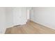 Empty bedroom with hardwood floors and a view into the hallway at 601 White Birch Ln, Angier, NC 27501