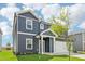 Two-story home featuring a two-car garage and blue siding, with a well maintained lawn at 601 White Birch Ln, Angier, NC 27501