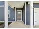 Close up of the front door, and siding and entrance of new construction home at 601 White Birch Ln, Angier, NC 27501