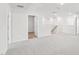 Hallway with neutral carpet, white walls, and access to other rooms at 601 White Birch Ln, Angier, NC 27501
