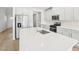 Bright kitchen featuring stainless steel appliances, white cabinetry, and a large center island at 601 White Birch Ln, Angier, NC 27501