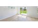 View of a sliding glass door leading to backyard, with hardwood floors and natural light at 601 White Birch Ln, Angier, NC 27501