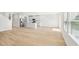 Bright, open-concept living room and kitchen with hardwood floors and stainless steel appliances at 601 White Birch Ln, Angier, NC 27501