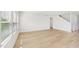Living room featuring hardwood floors, natural light, and white paint at 601 White Birch Ln, Angier, NC 27501