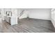 Open concept living space with kitchen, white walls, and luxury vinyl plank flooring at 601 White Birch Ln, Angier, NC 27501