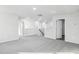Bright upstairs landing featuring neutral paint, plush carpeting, and laminate flooring at 601 White Birch Ln, Angier, NC 27501