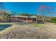 Brick home featuring a covered back porch, perfect for outdoor relaxation at 604 Orange Factory Road, Bahama, NC 27503