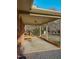 Covered back porch featuring brick and wood railing overlooking a grassy yard at 604 Orange Factory Road, Bahama, NC 27503