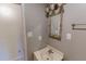 Small bathroom with a vintage framed mirror and a single sink at 604 Orange Factory Road, Bahama, NC 27503