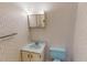 Bathroom with patterned wallpaper, vanity, and toilet at 604 Orange Factory Road, Bahama, NC 27503