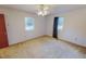 Bright bedroom with two windows providing natural light and ceiling fan at 604 Orange Factory Road, Bahama, NC 27503