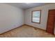 Neutral bedroom with one window and built-in closet for storage at 604 Orange Factory Road, Bahama, NC 27503